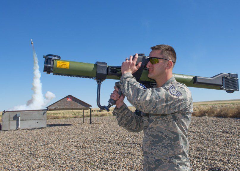 airman firing weapon