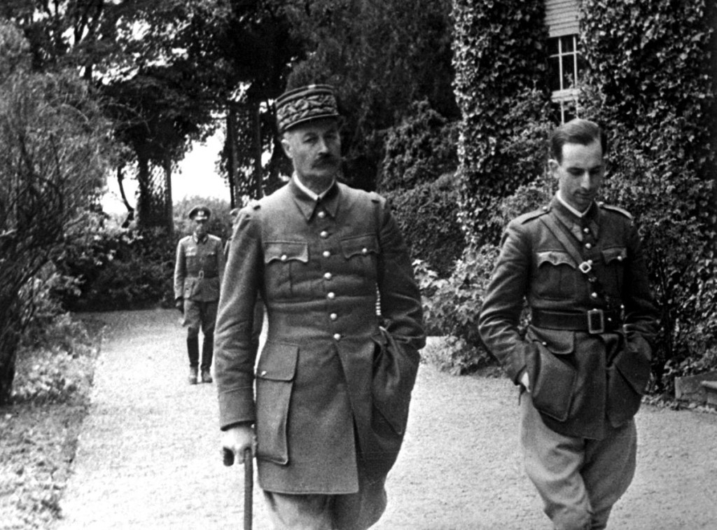 Two officers walk through a park