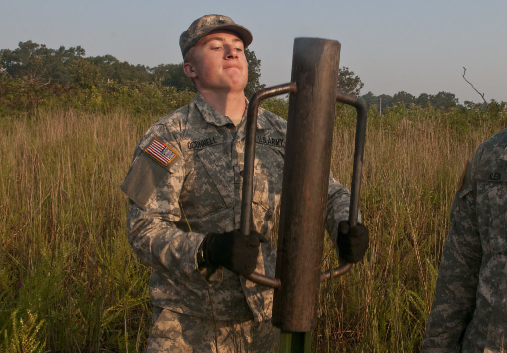 sappers putting in fence post