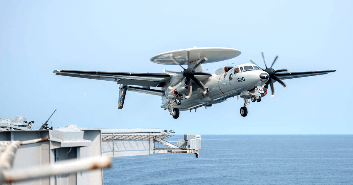 Watch as an E-2C Hawkeye nearly crashes off a carrier deck