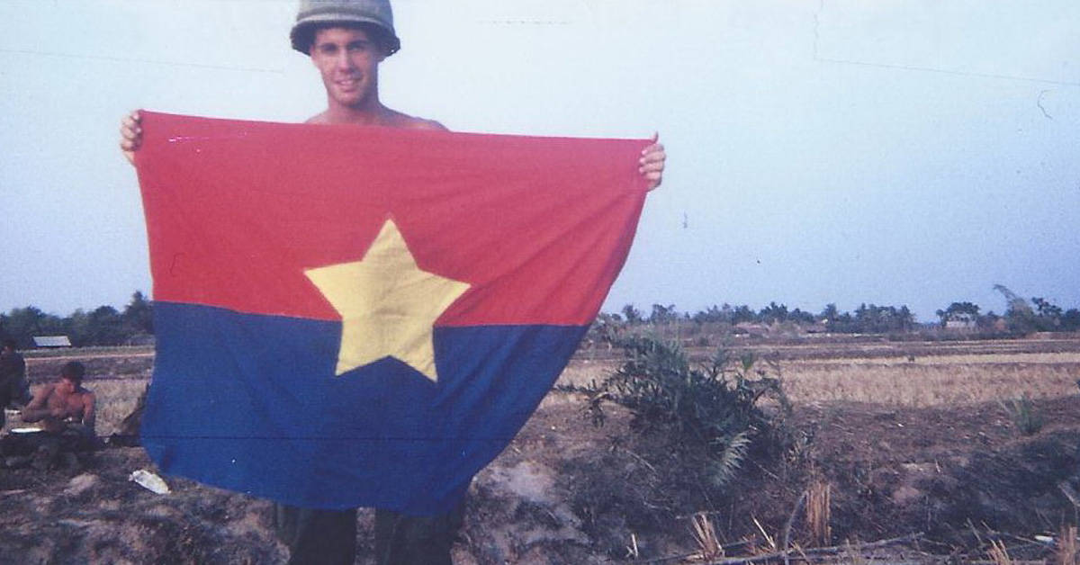 These 13 photos of US troops with enemy flags show some traditions never die