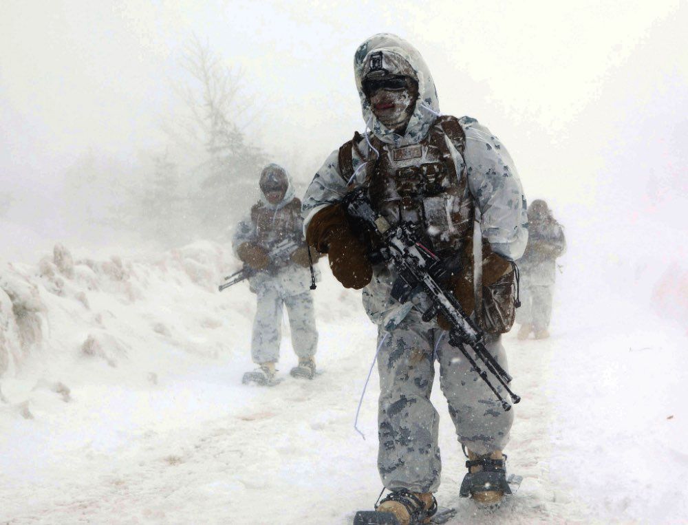 Cold Marine in a camo snow suit