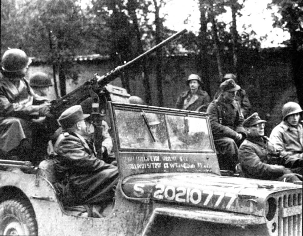  Americans escort two captured German prisoners from the Metz garrison in 1944. One of their nicknames became the iron men of metz