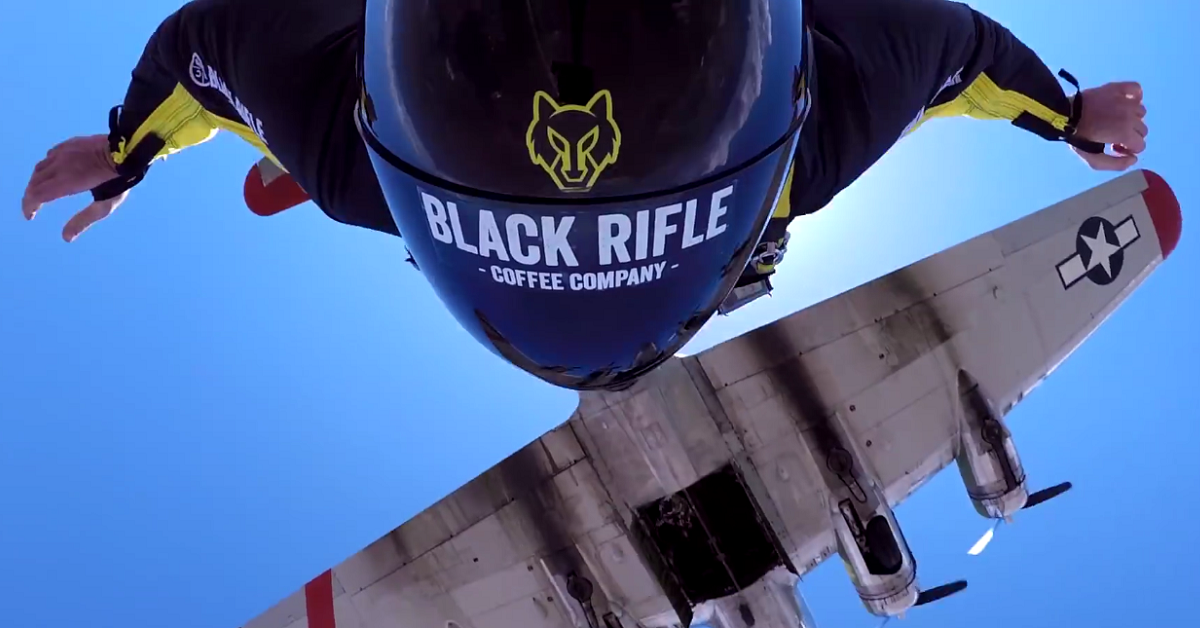 Watch these skydivers jump out of a B-17’s bomb bay door with wingsuits and Ol’ Glory