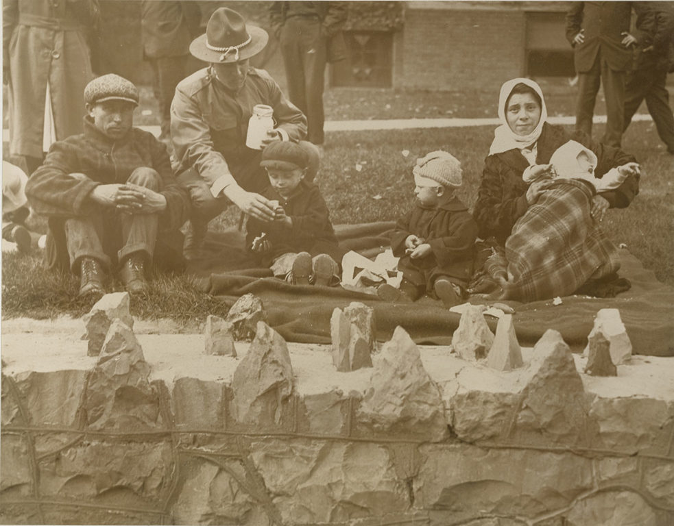 soldier feeding orphans