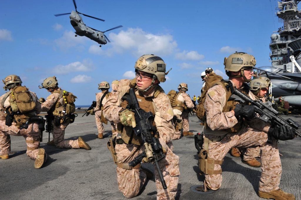 marine on a ship ready for zombie apocalypse