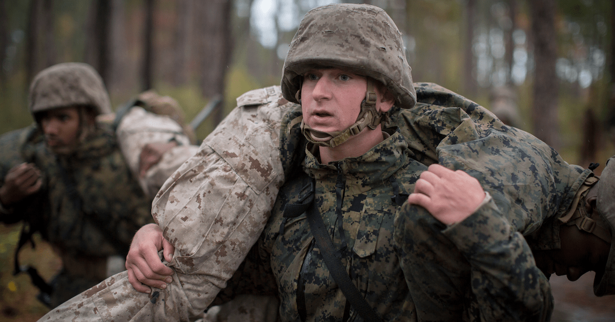 Recruit lifting another marine