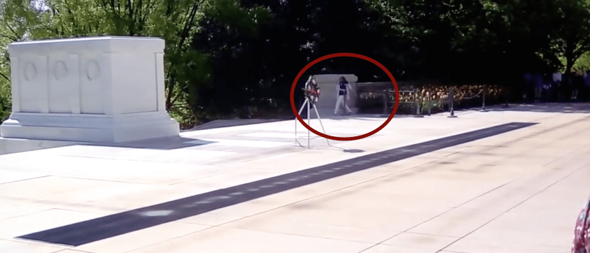 A woman tries trespassing past the sentinel to the Tomb of the Unknown.