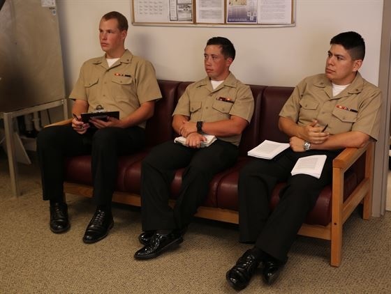 Sailors with the Ground Combat Element Integrated Task Force listen as their senior Fleet Marine Force corpsmen instruct them on FMF knowledge at the unit's task force aid station.

(Photo by Marine Cpl. Paul S. Martinez)