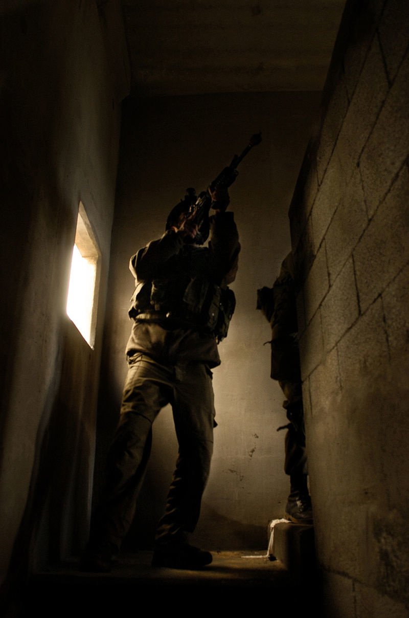 sayeret matkal operator clears a cinder block building