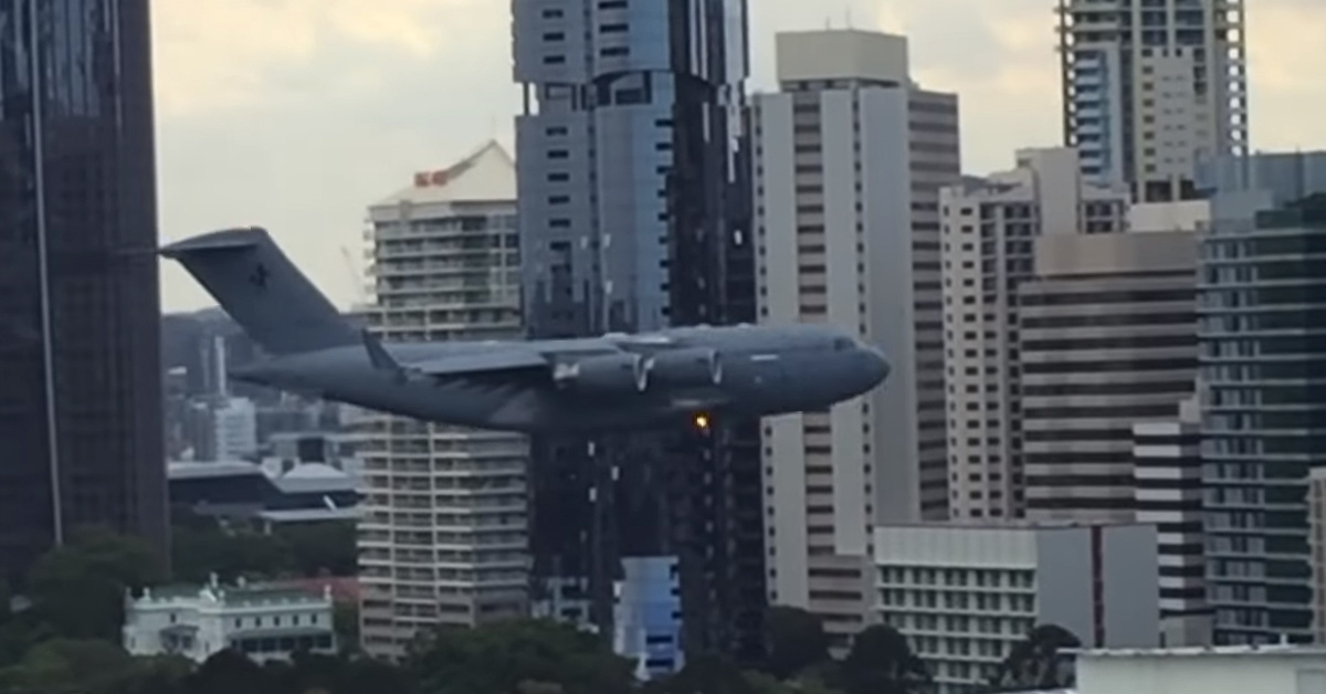 Watch crazy Australians fly a C-17 between city buildings