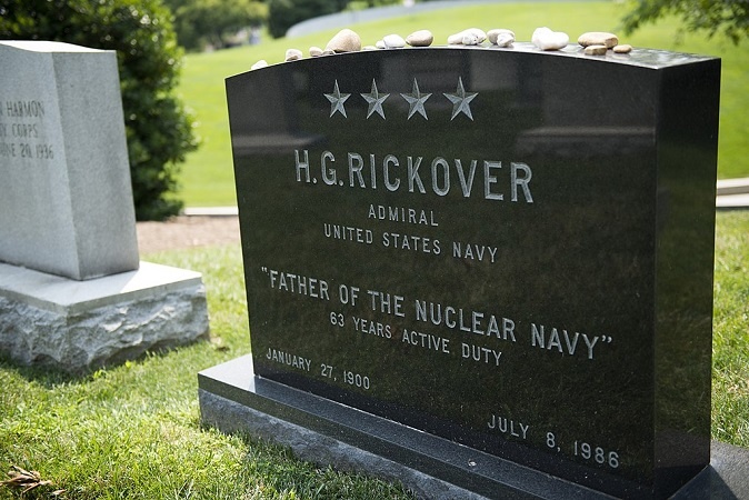 Coins on military headstones and pebbles