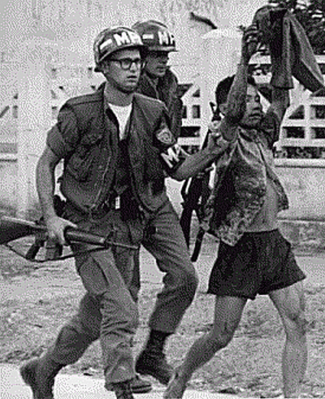 military police with captured viet cong fighter