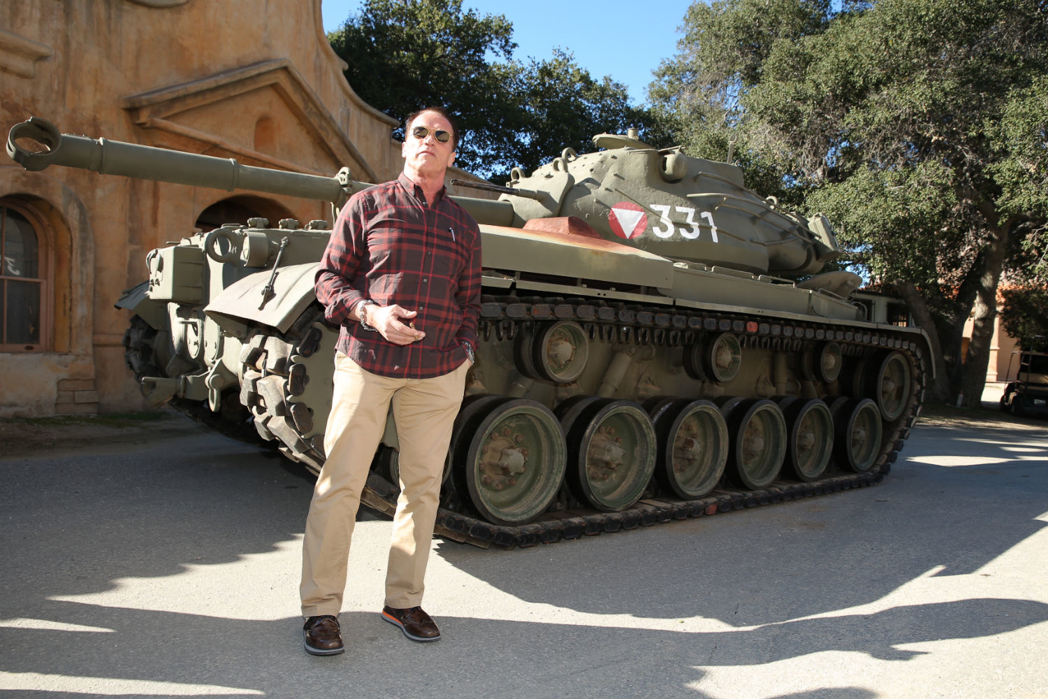 Arnold Schwarzenegger drives the same tank he trained on in the Army